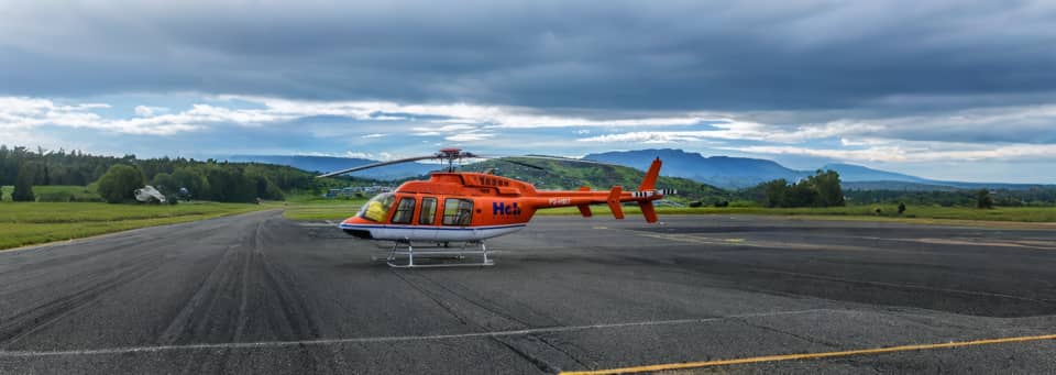 Helicopter scenic flight over Papua New Guinea mountains and coastline