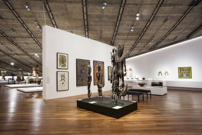 PNG National Museum & Art Gallery exhibition hall with carvings and paintings