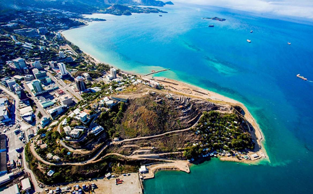 Aerial view of Port Moresby city and its turquoise coastline